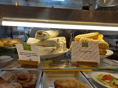 Labelled vegan wrap and sausage roll at Lloyd Park Lounge Café in Croydon