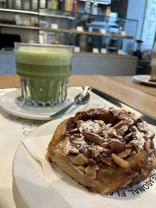 Oat matcha latte and almond roll  at Arket Café - Milan in Milan