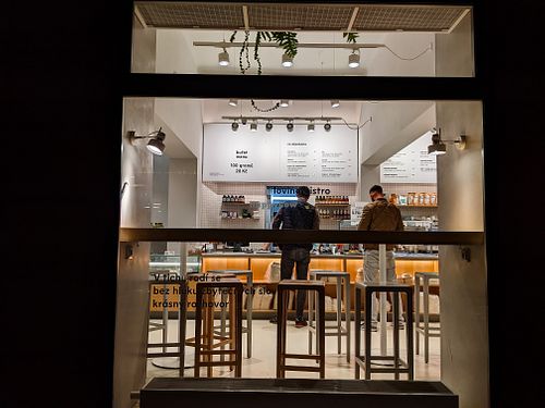 Looking through an outside window at Loving Bistro at Loving Bistro in Prague