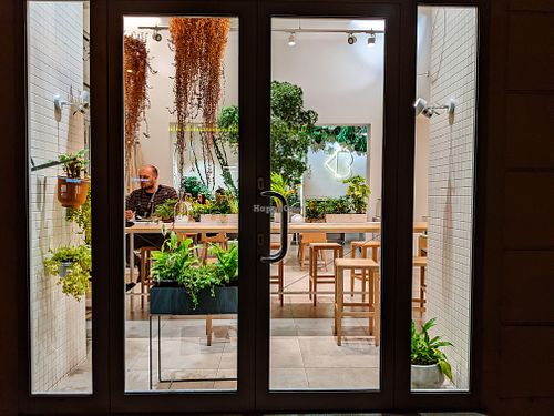 Looking through an outside window at Loving Bistro at Loving Bistro in Prague