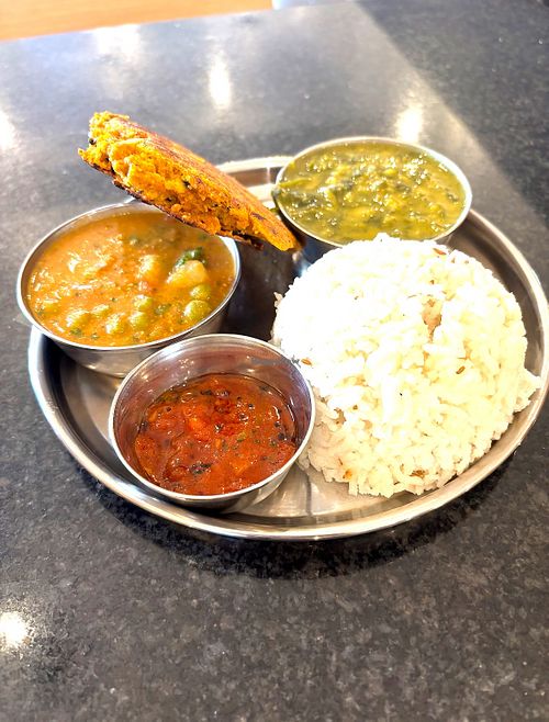 Rice, spinach Dahl, chickpea subji, tomato chutney and a sweetcorn pancake  at Govinda's in Swansea