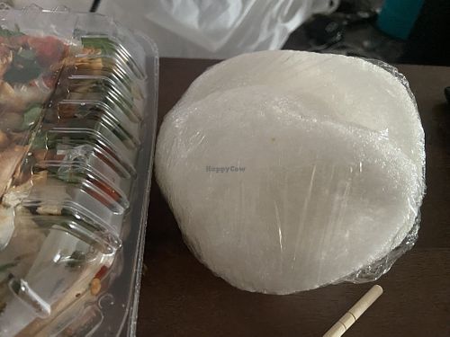 The rice crackers that come with the salad, put some salad on top and eat it or crack them into the salad  at Tang's Asian Vegetarian in San Jose