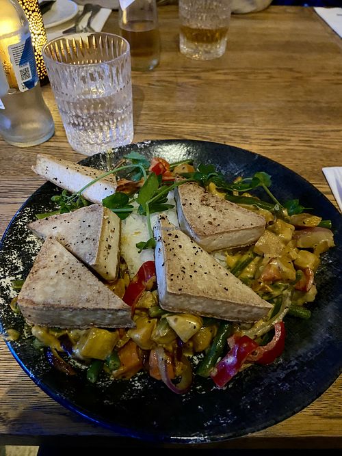 Vegetable curry with tofu, green beans, sweet potato and bell pepper.  at Het Strand in Katwijk Aan Zee