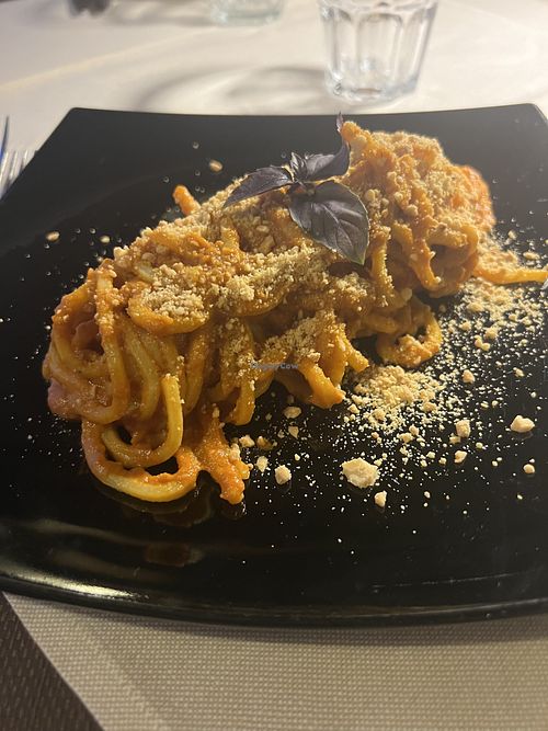 Tonnarello di pesto rosso con mandorle, melanzane e baslico fresco  at La Voglia in Malcesine