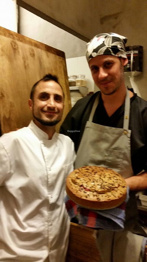 Carlos and Christian, the chefs at El Cafe Blueproject, showing vegan raspberry cake....just out of the oven!  at El Cafe Blueproject in Barcelona