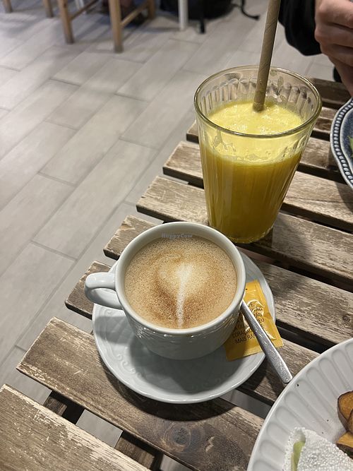Oat latte and orange juice  at Amaria Café in Costa Da Caparica