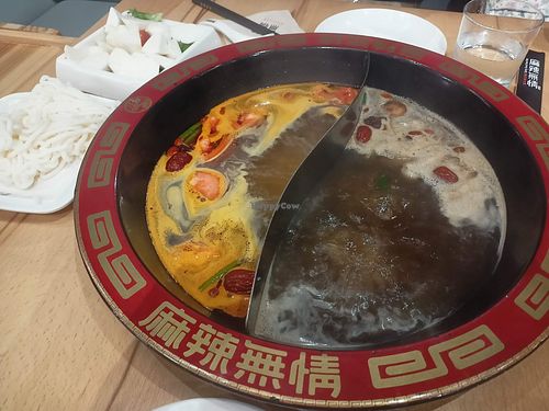 Tomato and mushroom stock at Restaurante Spicy Soul Hotpot in Sevilla