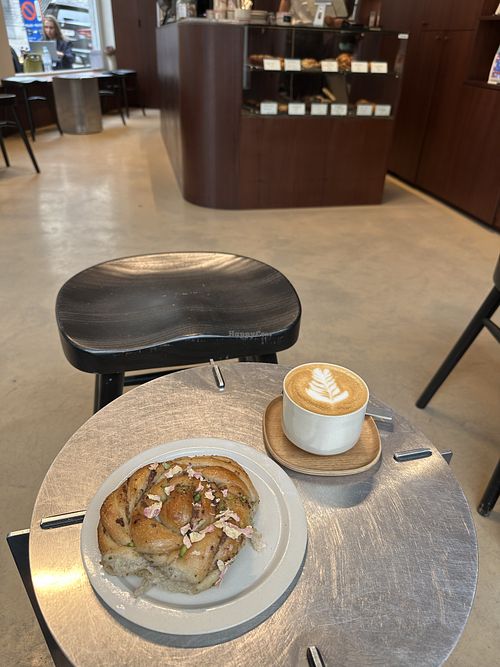 Oat milk flat white and vegan pistacchio bun  at Wide Awake X Oatly in Brussels