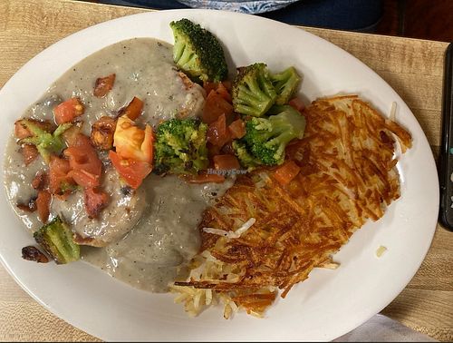 Vegan Biscuits and Gravy topped with Grilled Broccoli and Tomatoes with Hash Browns at Willalby's Cafe in Madison