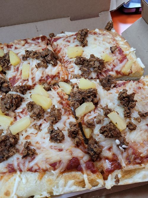 Plant-based cheese, plant-based sausage, and pineapple at Cottage Inn Pizza in East Lansing