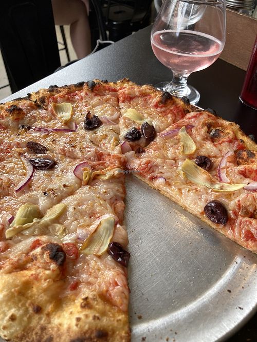 Vegan cheese pizza with olives, onions & artichokes    at Fire on Fifth in Peru