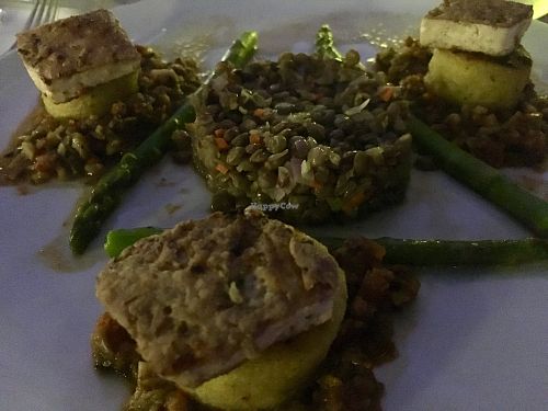 Polenta galettes, tofu, lentils, and asparagus  at Elements Restaurant in Oranjestad