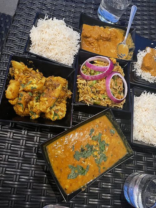 from left to right, top to bottom: basmati rice, chicken korma, aloo gobi, vegetable biryani, dal tadka  at Himalayan Kitchen  in Somerville