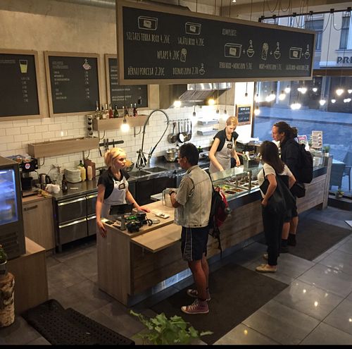 friendly staff helping customers choose at Terra in Riga