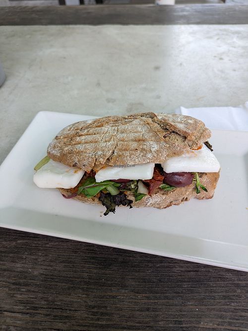 Bog slabs of vegan cheese, served warm or cold. at Little Green Rabbit  in Berlin