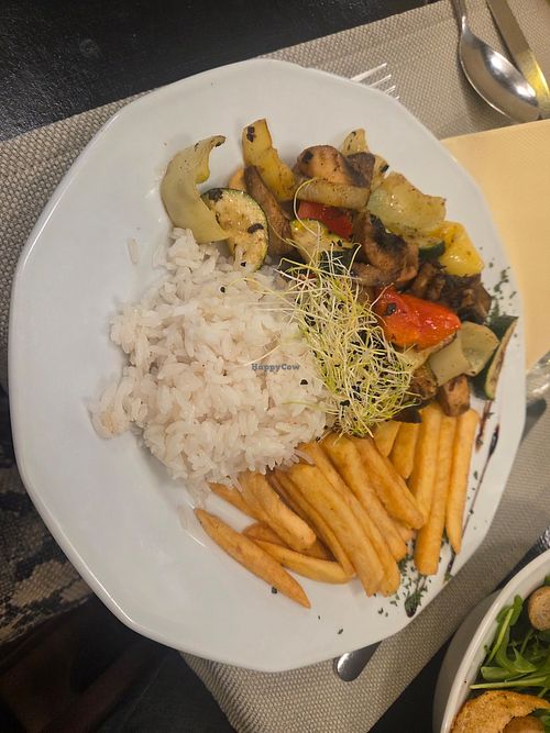 Grilled vegetables (eggplant, zucchini, peppers, mushrooms) with fried potatoes and jasmine rice at Sirály Étterem in Visegrad