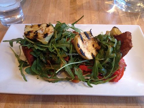Tomato & Chilli Farinata with griddled artichokes, pepperonata and rocket at Maitreya Social in Bristol