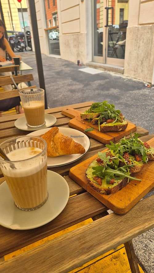 Avocado toast, caffe latte and vegan croissant at Materia in Rome