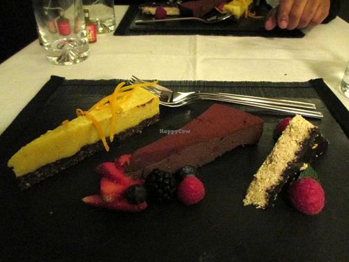 Orange-mango raw cheescake, chocolate/coconut raw cake, and chocolate-coated sesame 'halwa' cake -- dessert for New Year's Eve set menue at Raw - La Suite West in West London