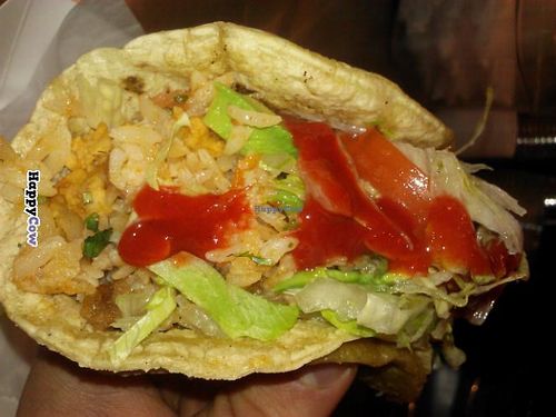 Tempeh tacos topped with tomato, lettuce, salsa. at Tacos El Cunado - Downtown Market in Grand Rapids