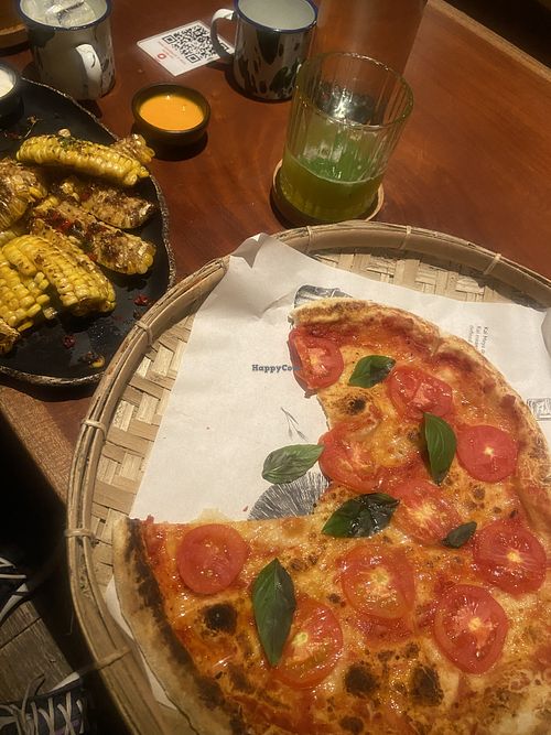 Vegan pizza and grilled corn  at Kai Meya in 
