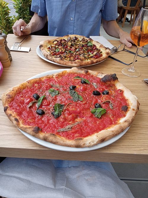 Sicilian Caponata dish and several pizza options. Also pasta dishes that can be customized. at Cibò Cefalù in Cefalu