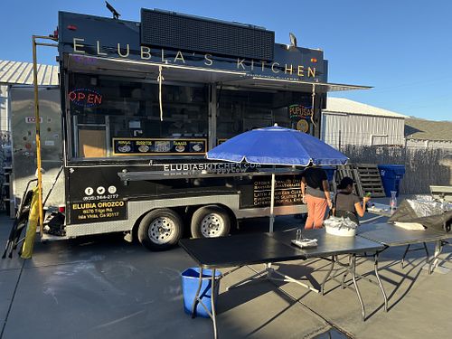 Food truck parked behind a paint store   at Elubia's Kitchen - Santa Barbara Cider Location in Goleta in Goleta