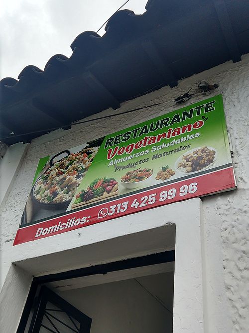 Exterior sign above entry door at Restaurante Vegetariano in Bucaramanga