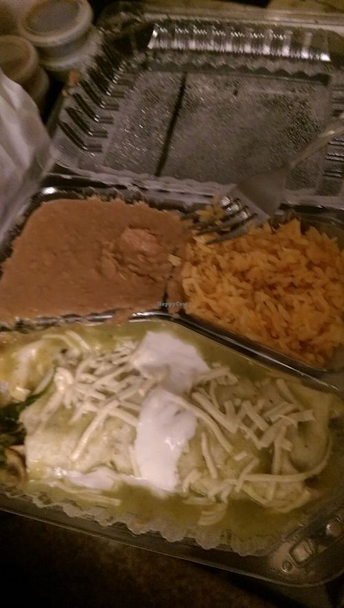 Vegan Enchilada Suiza
(flour tortilla filled with sauteed mushrooms, broccoli, zucchini, carrots, and spinach, topped with green sauce, vegan cheese and vegan sour cream served with beans and rice)
I took a bite and almost forgot to take a picture at Habanero's Bar and Grill in Scotts Valley