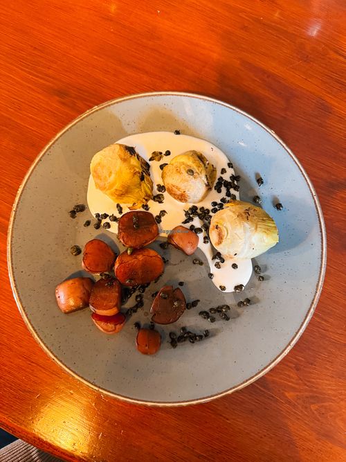 Grilled artichokes & balsamic braised radish served with vegan garlic yogurt & crispy capers   at Palmers Ale House And Kitchen in Spalding