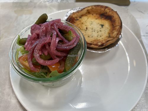 Mushroom pie served with side salad (with pickled cabbage and pickles with a vinaigrette sauce).   at AMS - Salon Deli in Amsterdam