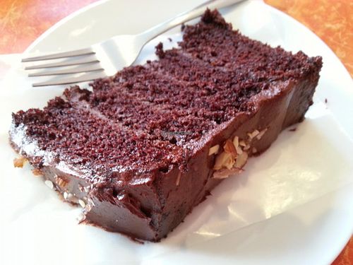 Rich, moist, five-layered vegan chocolate cake. Delicious! at Little Phatisserie in Bexhill