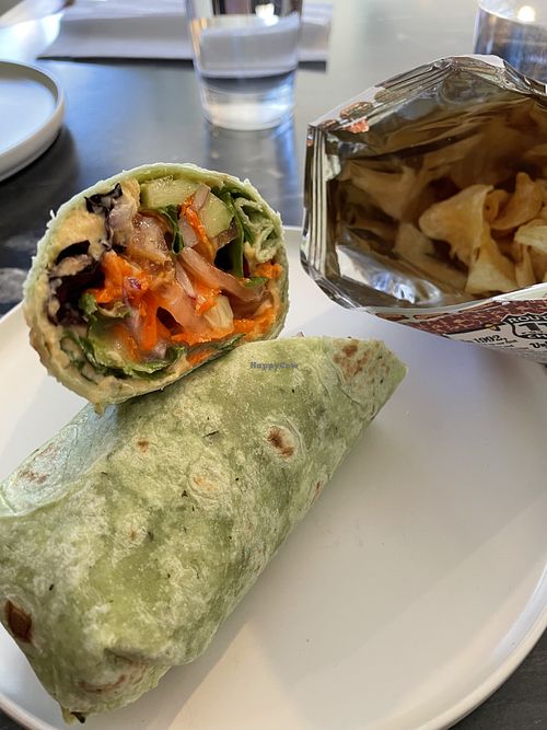 Vegan hummus and veggie wrap with chips. Everything is very fresh and quickly prepared    at Coco + Hazel in Richmond