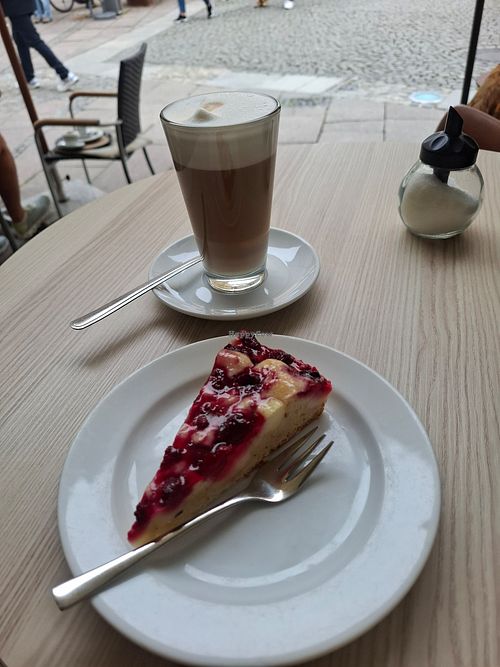 Vegan raspberry cake and Latte Machiatto with Oat Milk at Caffè Lucca in Fuessen