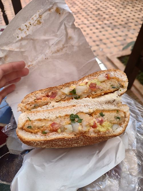 Maâkouda with toppings on bread at Snack Ba Taib in Meknes