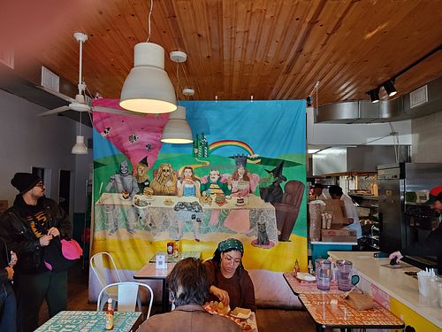 Funky art adorns the dining room and bathroom at Comfortland in Astoria