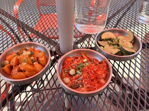 Free appetizers. Spicy potatoes, zucchini, and KimChee  at Bebap in Rochester