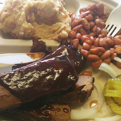 BBQ Plate with seitan brisket with baked beans and potato salad.  As always, served with pickles, onions, and bread on the side. at BBQ Revolution in Austin