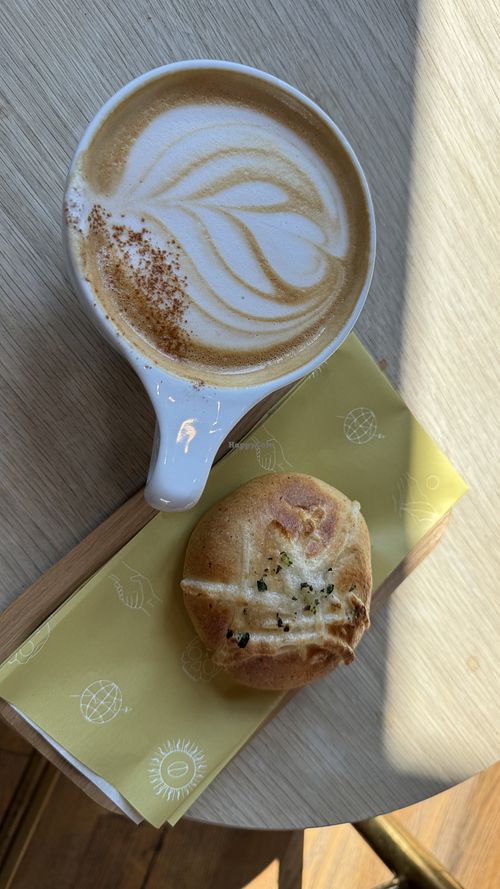 Pumpkin miso latte and Vegan Curry Kolache 😍  at Onyx Coffee Lab - Rogers HQ in Rogers