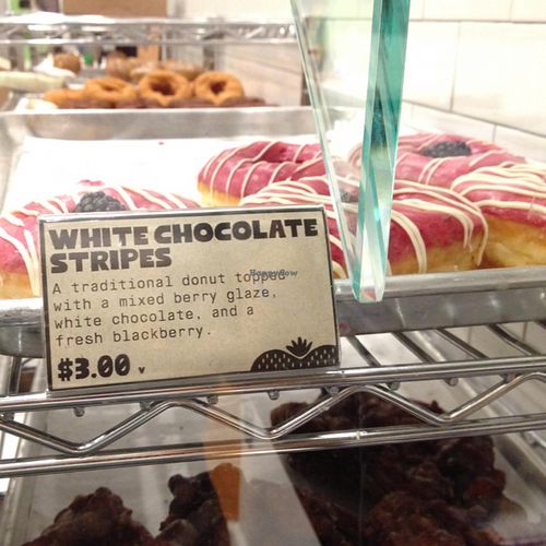 donut case: the 'V' next to the price = vegan at Donut Friend - Highland Park in Los Angeles