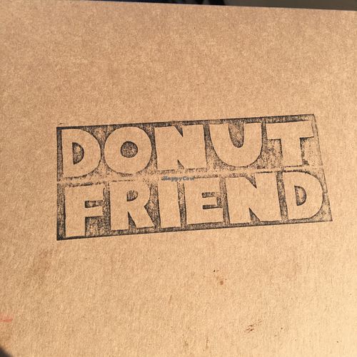 Cool logo on the box at Donut Friend - Highland Park in Los Angeles