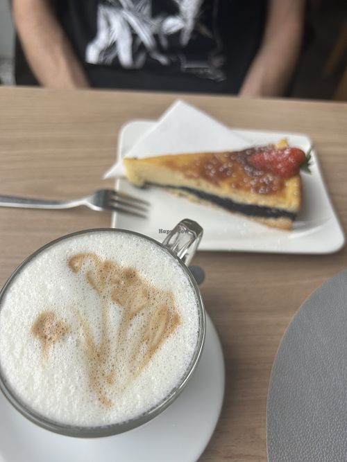 Veganer Cappuccino und veganer Käse-Mohn-Kuchen  at Cafe Jolie an der Donau in Regensburg