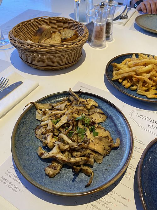 Vegan grilled oyster mushrooms and local fried potatoes  at Mezedopoleion Kyklos in Protaras