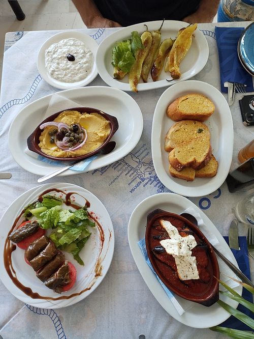 Green peppers, fava puree, garlic bread, stuffed vine leaves. The aubergine bake can be made vegan by omitting the feta at Taverna Leonidas Petriti in Corfu
