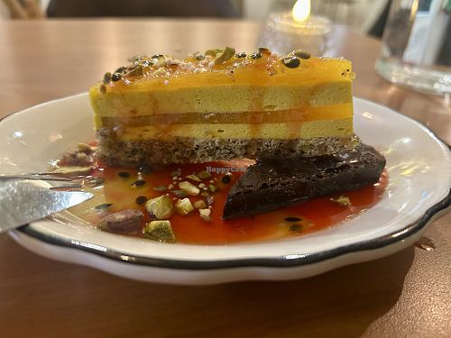Partially frozen passion fruit dessert + brownie  at Hum Vegan in Montreal
