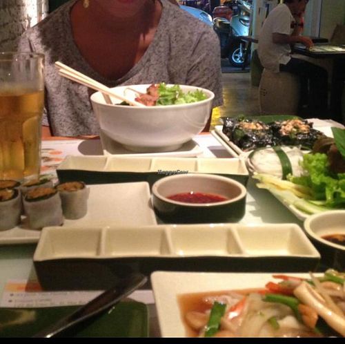 4 dishes, 2 beers, 500,000 dong. 4 dishes was too much for 2 people - we could.not possibly finish it all at Wrap and Roll in Ho Chi Minh City