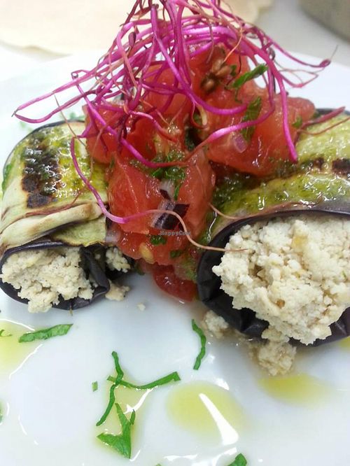 Dragon Wings: grilled aubergine rolls with tofu, beet tops and tomatoes at So What?!? in Rome