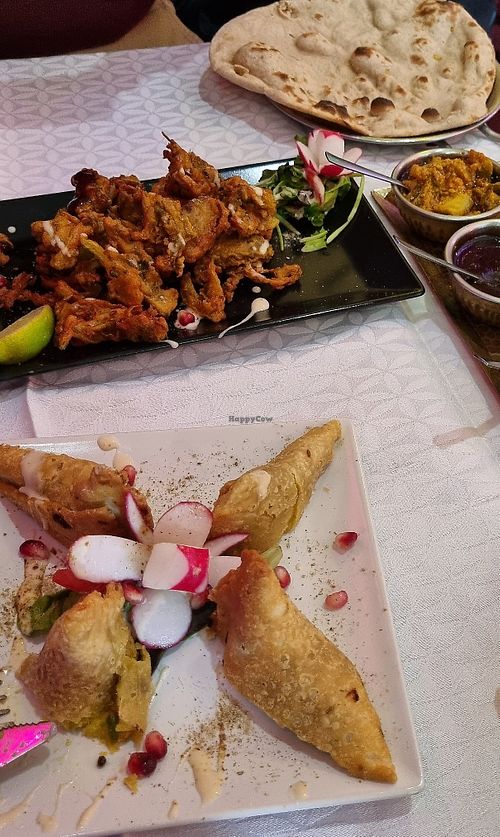 Bhaji & Samosas. Side dishes included (untouched) raita. at Le Taj Mahal in Saint-gervais-les-bains