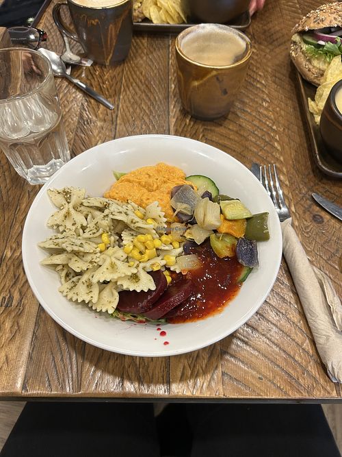 pesto pasta salad bowl with coconut milk latte  at The Deli Next Door in Elgin