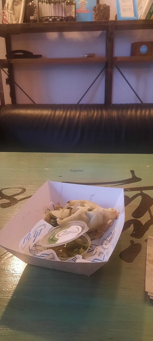 Spinach empañada with chimichurri salsa at La Tranquera Solo Empanadas in Cordoba